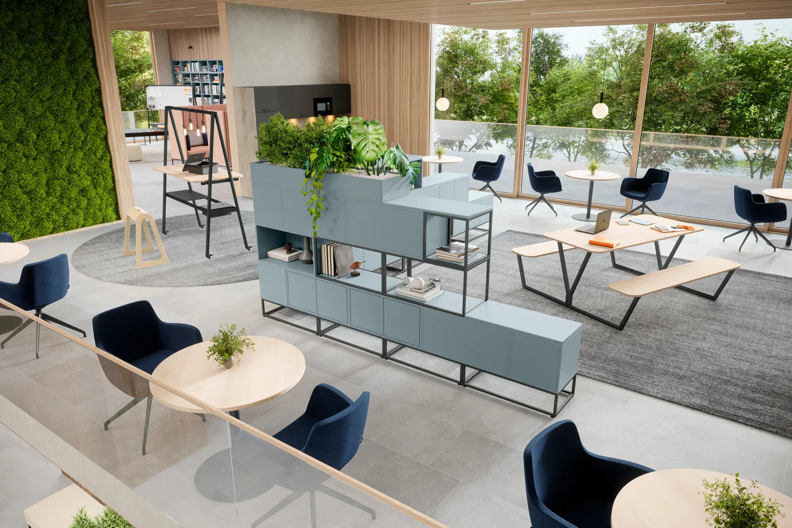 Offene Bürofläche mit Teeküche, begrünter Wand, Picknickbank und Sitzgruppen an der Fensterfront